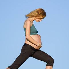 Image showing pregnant woman on meadow