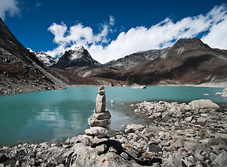 Image showing Balance: Stone stack and Sacred Lake near Gokyo