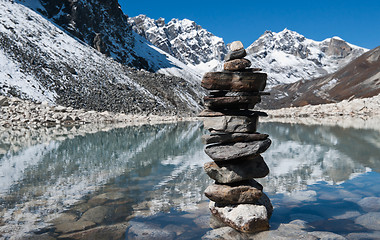 Image showing stability: Stone stack and Sacred Lake near Gokyo 