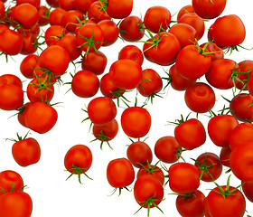 Image showing Tasty red cherry tomatoes flow over white