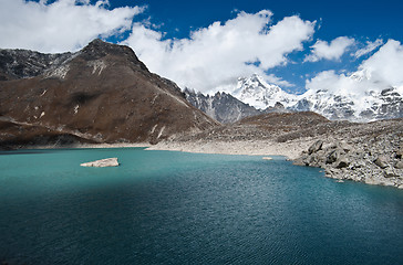 Image showing Snowed Mountains and Sacred Lake near Gokyo