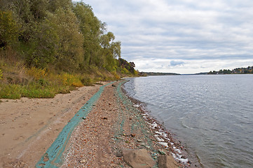 Image showing Chemical waste on the riverbank