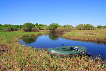 Image showing green boat on small river