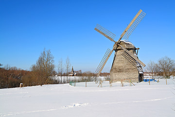 Image showing aging mill on snow field
