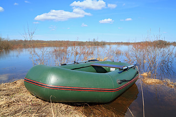 Image showing rubber boat on coast river