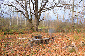 Image showing aging bench in autumn park