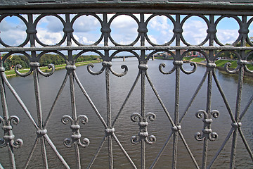 Image showing bridge banisters through greater river