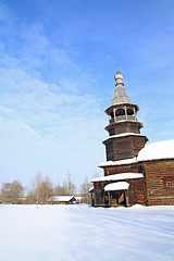 Image showing wooden chapel on snow field 