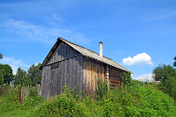 Image showing wooden rural house amongst herbs