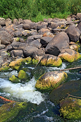 Image showing quick river flow amongst stone