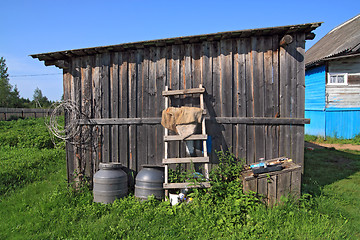 Image showing rural shed on green herb
