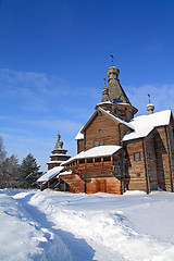 Image showing wooden chapel on snow field 