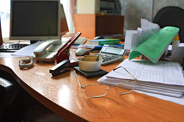 Image showing spectacles on table in office