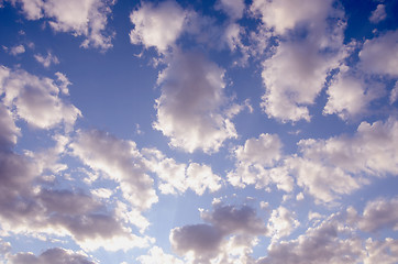 Image showing cloudy blue spring sky sun-lit background 