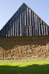 Image showing Ancient house with mole walls and wooden roof.