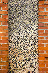 Image showing Wall made of brick and concrete with little stones