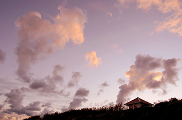 Image showing Small wooden house at seaside on background of sky 