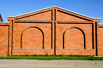Image showing Red brick building wall with decorations. 