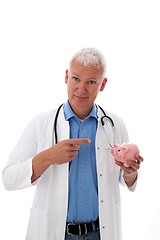 Image showing Doctor with piggy bank