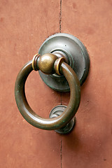 Image showing Metal door knocker on wooden door