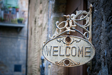 Image showing Welcome sign on log home