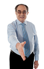 Image showing Confident modern businessman offering handshake
