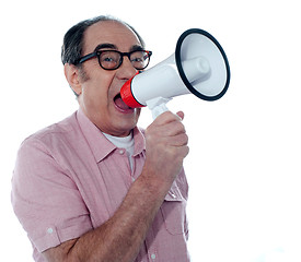 Image showing Senior casual male with megaphone