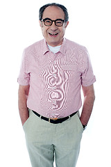 Image showing Smiling casual senior man with hands in pocket