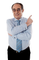Image showing Senior businessperson pointing away