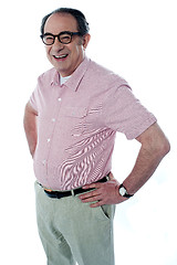 Image showing Casual man standing with hands on his waist