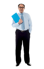 Image showing Corporate businessman holding document