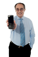 Image showing Senior sales manager promoting blackberry
