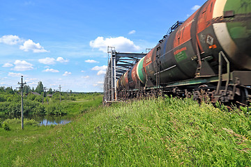 Image showing freight train near railway bridge