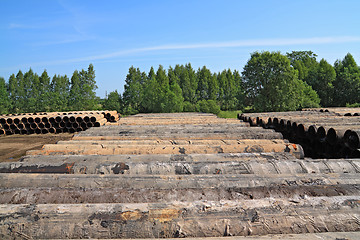 Image showing old gas pipes on dirty road