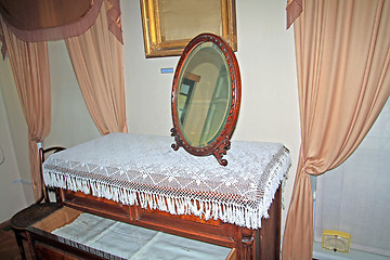 Image showing ancient mirror on old dresser