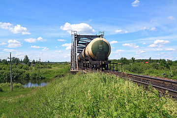 Image showing freight train near railway bridge