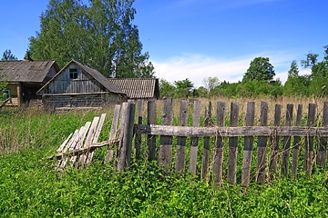 Image showing old fence near rural wooden building