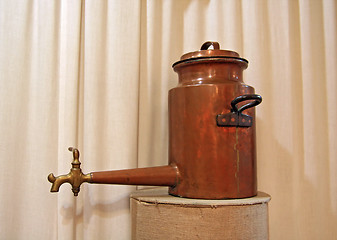 Image showing ancient copper teapot on stand