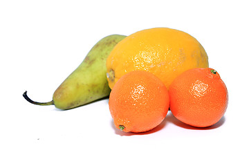 Image showing pear, tangerine and lemon on white background