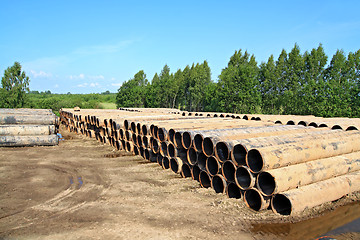 Image showing old gas pipes on dirty road