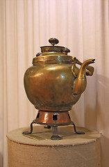 Image showing ancient copper teapot on stand