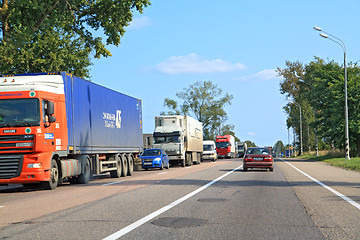 Image showing cargo cars on asphalt road