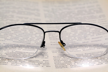 Image showing spectacles on old book