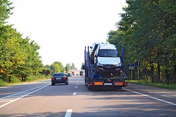 Image showing cargo cars on asphalt road