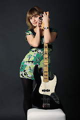 Image showing Young beautiful girl with a guitar