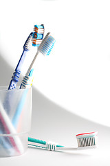 Image showing Toothbrushes in a glass