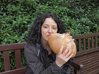 Image showing Girl eating bread