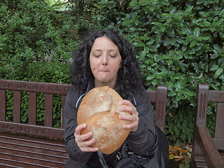 Image showing Girl eating bread