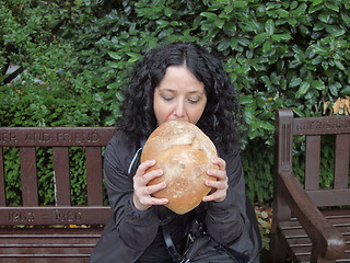 Image showing Girl eating bread