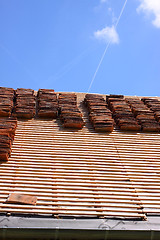 Image showing renovation of a tiled roof of an old house